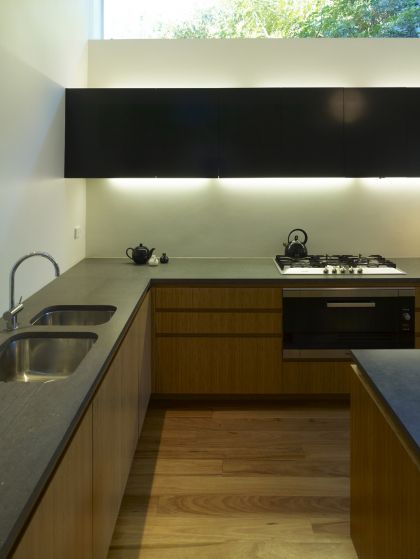 Hird Behan House kitchen joinery detail at night